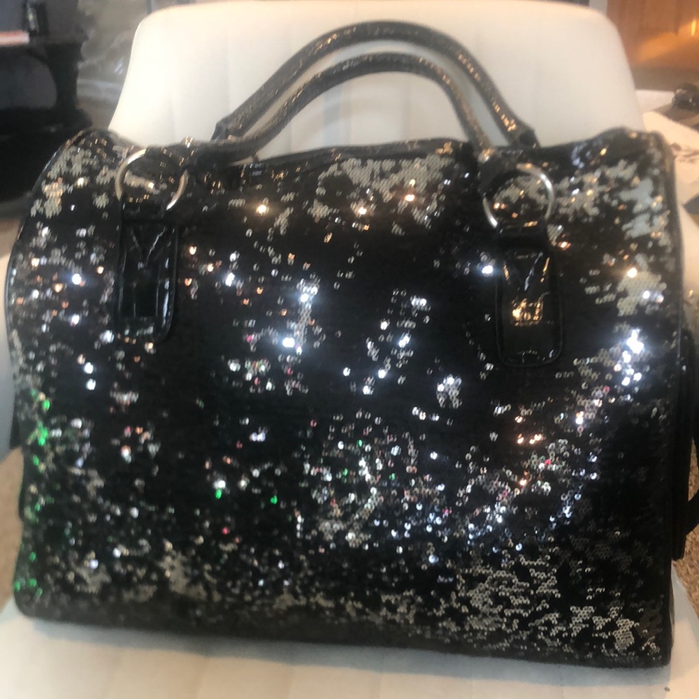 Big weekender fancy black bag. One side is sequence and the other embossed croc.